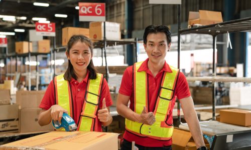Portrait of staff worker standing in warehouse with his arm crossed looking at camera. Portrait of staff worker standing in warehouse with his arm crossed looking at camera.